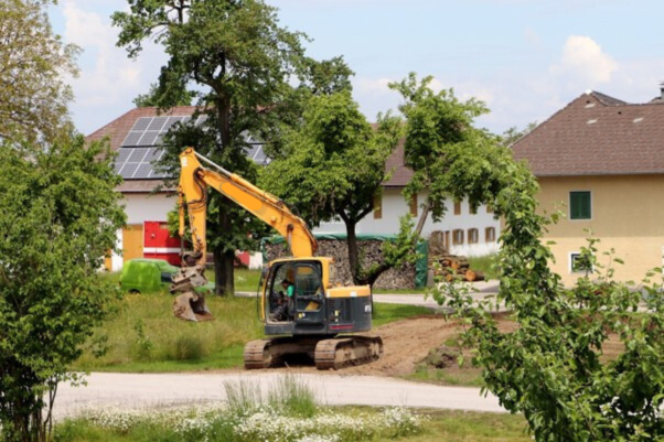 mini excavator at work in a residential area