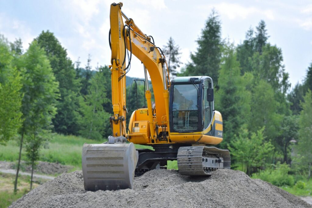 A mini excavator operating on a construction site