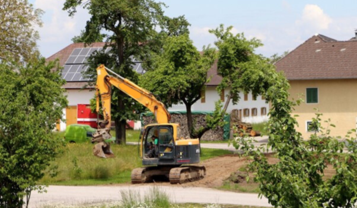 mini excavator at work in a residential area