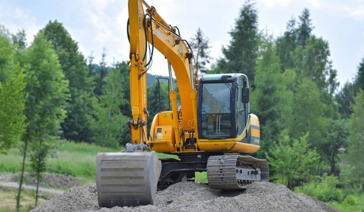 A mini excavator operating on a construction site